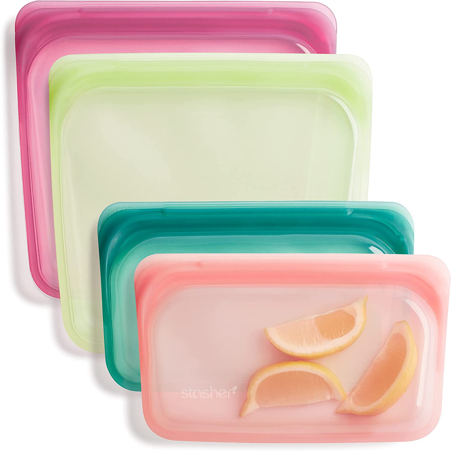 Four translucent silicone Stasher bags. Two Sandwich sized, one coral, the other lemon yellow. The remain two are half-sandwich sized bags one forest green, the other peach. 